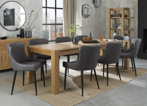 Turin Light Oak 6-10 Seater Table & 8 Cezanne Dark Grey Faux Leather Chairs - Black Legs